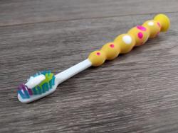 Image of a toothbrush with toothpaste on
